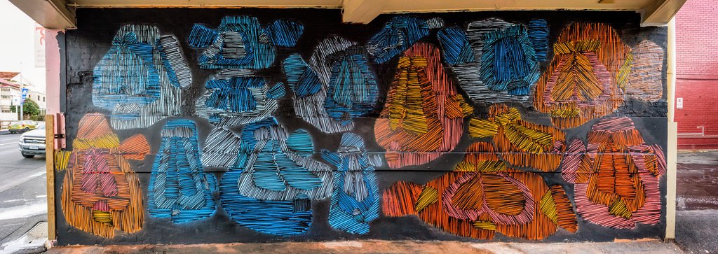 Mask mural at AdArt in Hobart by Jonny Scholes