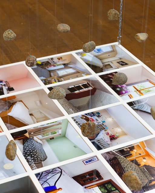 Close up of rocks hanging over the bedrooms in Lost Bedrooms, an artwork by Jonny Scholes.