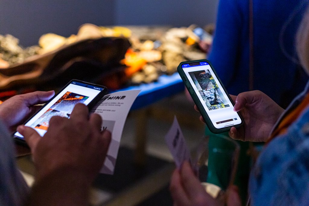 Visitors looking at their generated ArtMinr artworks